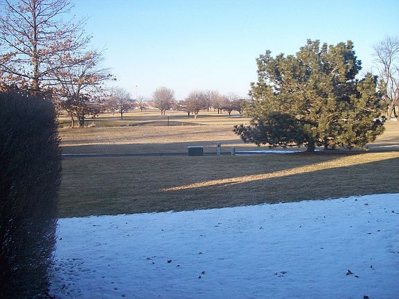 Golfcourse view from sliding glass doors in dining room