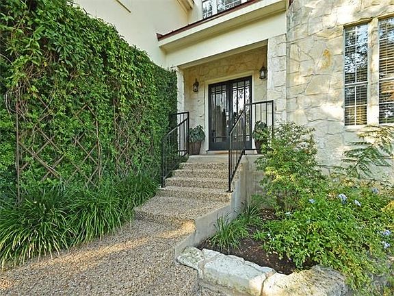 Stairs lead you to the front door.