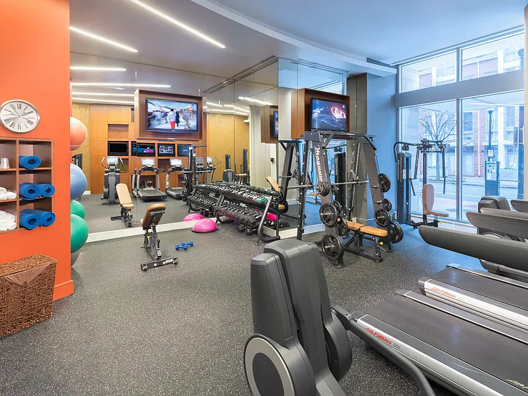 Fully-equipped fitness room with Pelotons