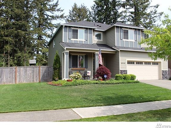 Another view of home, lot abuts green belt on the side.