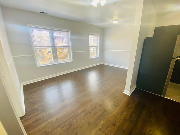 This is the unit after rehab! New Floors - Brand New Stainless Steel Appliances - New Bathrooms - New Paint (Light Blue)