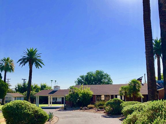 Main house with view of casita and storage