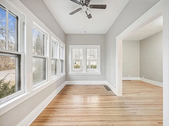 Bright sun room with many windows and Mississippi River views