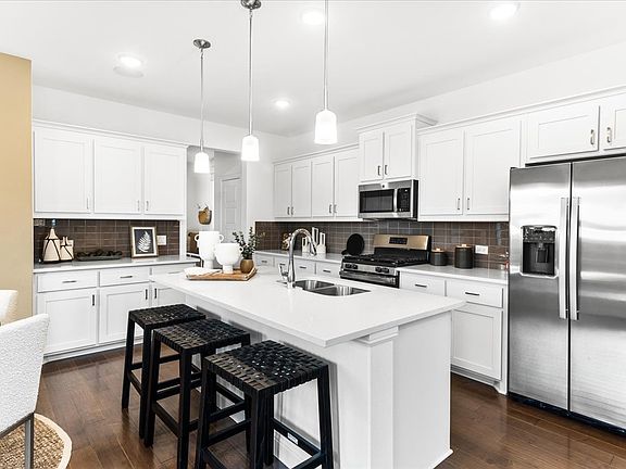 Walden floor plan featuring 4 bedrooms, 2.5 bathrooms, a breakfast area, covered patio, and a functi
