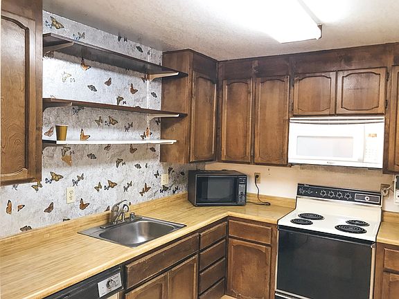 A closer view of the kitchen (check picture of new electric stove for reference)