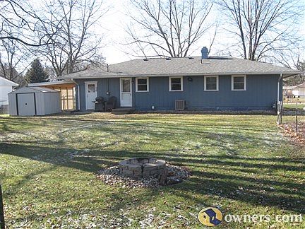 Back view of house, shed included in sale