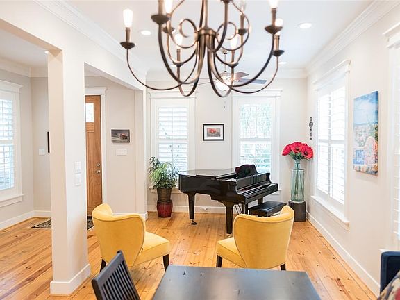 The versatile living room is open from the front entry and dining room.  Big enough to handle a baby grand piano and then some.