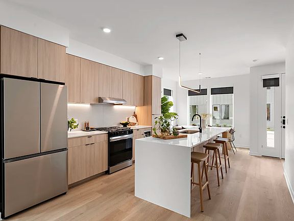 Elm cabinets, Drawer microwave (w. child lock), gas stove, wine/beverage fridge, and refrigerator included.