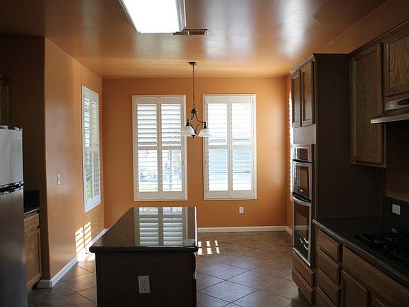 Kitchen, with plantation shutters on windows
