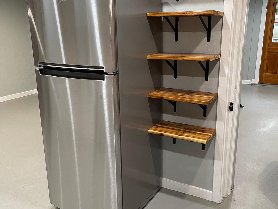 New refrigerator and open pantry.