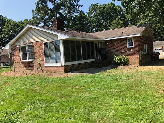 Back of home with screen porch
