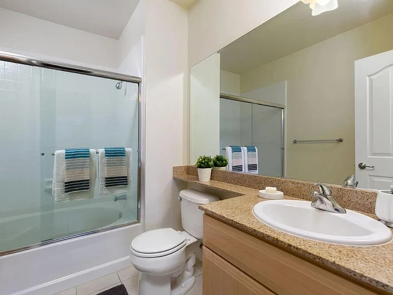Master bathroom shower over tub with glass doors