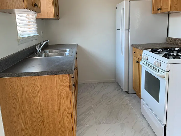 Kitchen. Tiled Flooring.