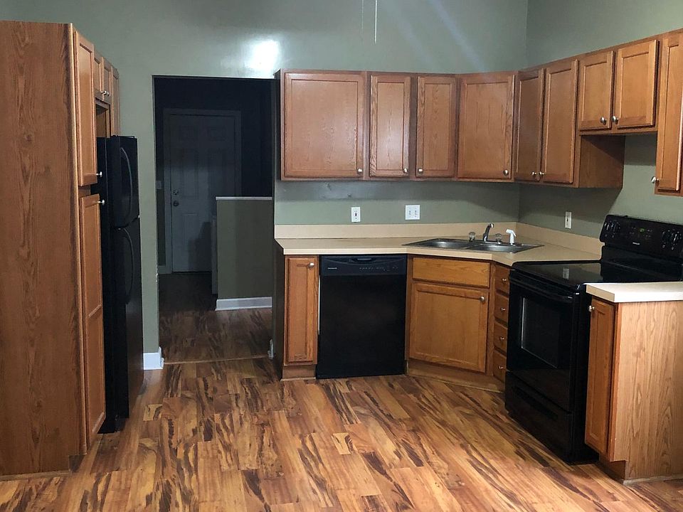 Kitchen view with black appliances.