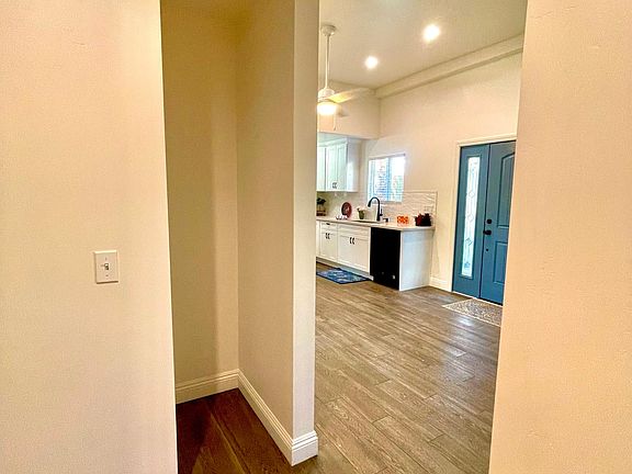 Nice Keeping Room. This area houses the Washer/Dryer Closet, an extra Closet and this Alcove to put a plant or display some of your favorite collections.