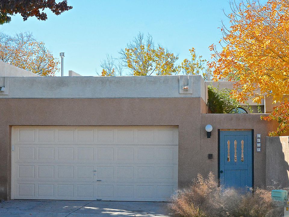 Private and secure front gate. 2 car garage with built-in work shop.