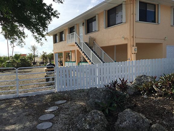 Fenced yard with large gate