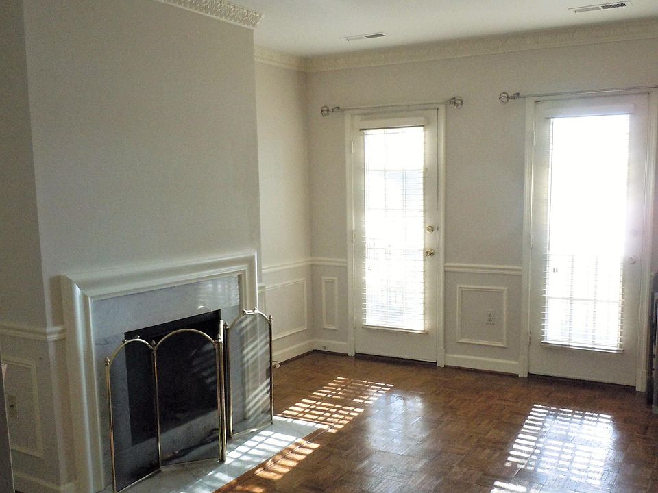 Living room with wood fireplace and french doors