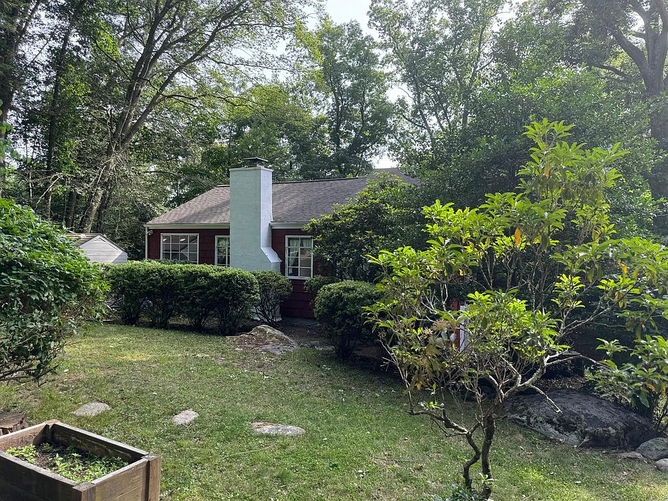 Front approach to house. Shows tranquil setting on private road.
