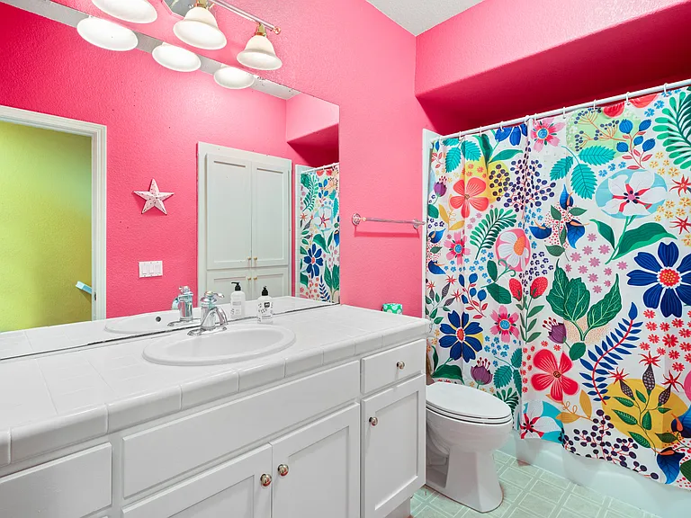 Upstairs bathroom with shower and bathtub.