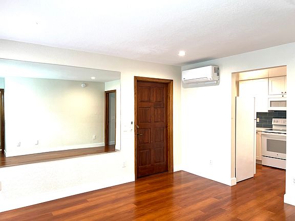 living area connects to kitchen