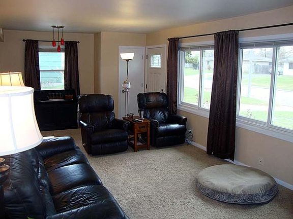 Main floor living room - looking from the bedroom hallway to the front door area.