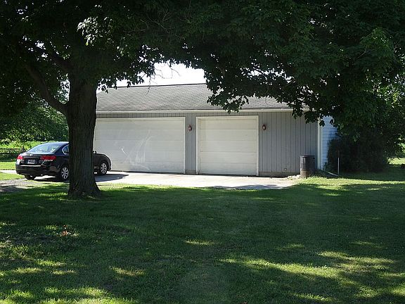 3 car garage with work area.