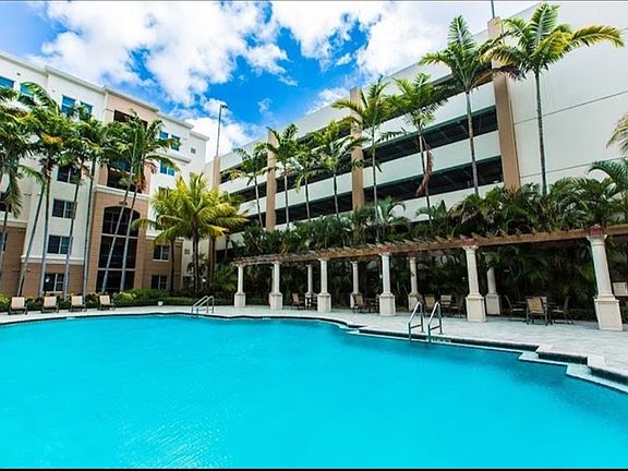 Main Pool with BBQ area, loungers, tables and chairs for relaxing after work or in the evenings .