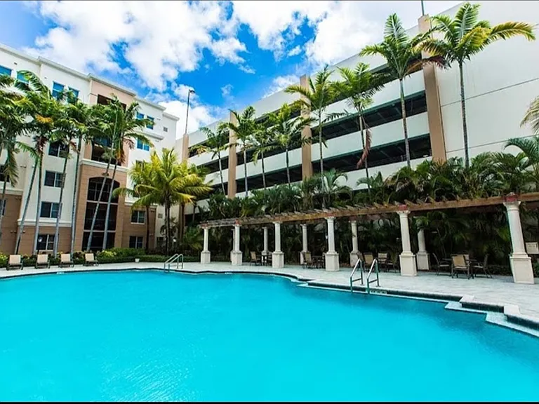 Main Pool with BBQ area, loungers, tables and chairs for relaxing after work or in the evenings .