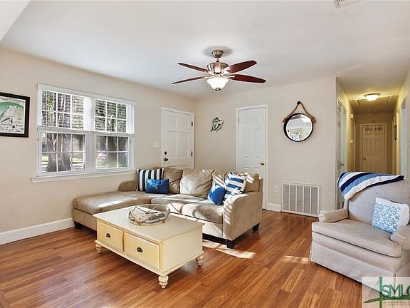 Laminate flooring was installed 2 1/2 years ago throughout home.  Ceramic tile in kitchen and bath.