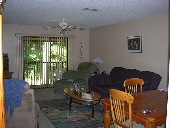 living room looking out to the screened balcony