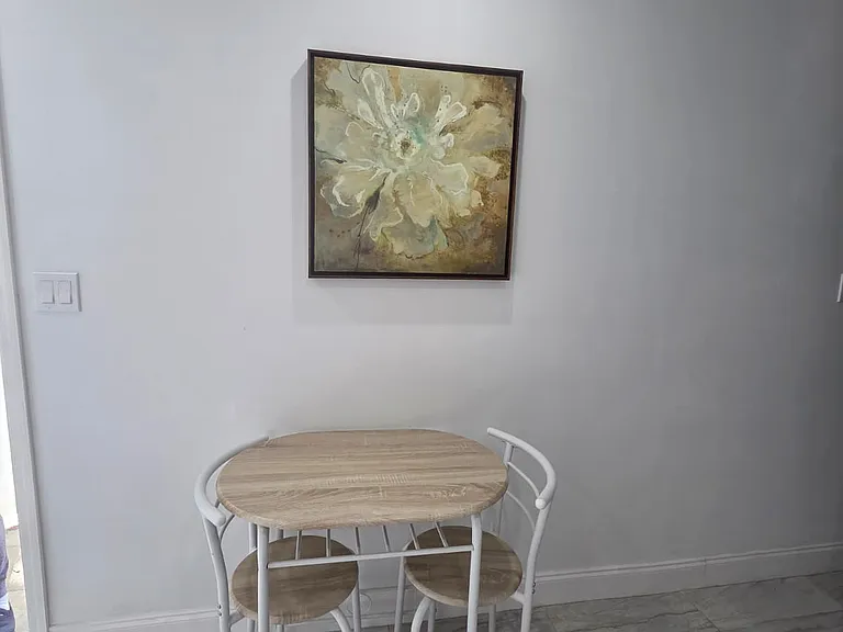 Inviting dining area for two with beautiful decorative touches.