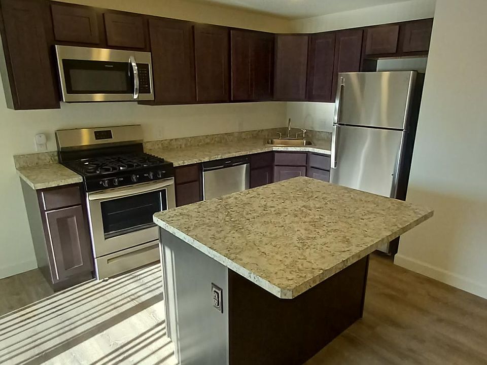 Kitchen with large island and plenty of cabinet/drawer space.