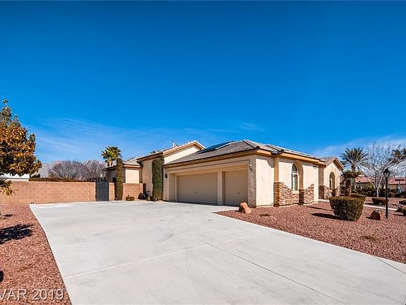 Enormous Driveway & Side Loading 3 Car Garage