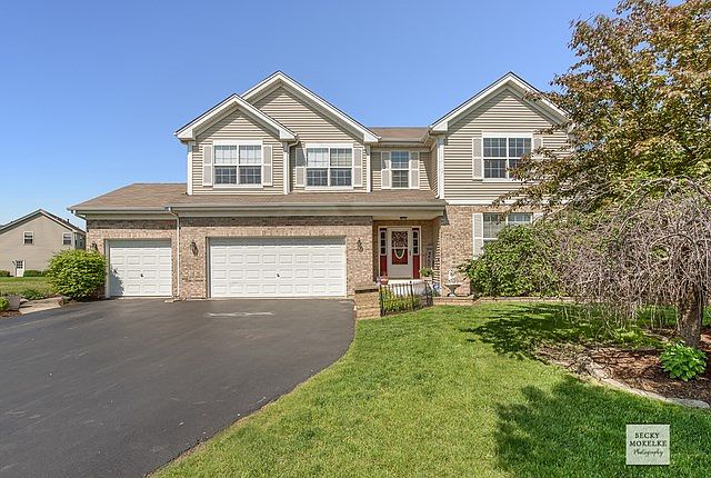 Lucious landscape with 3 car garage