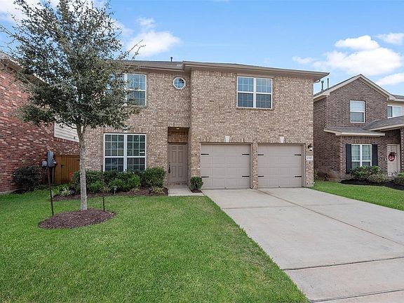 Low maintenance landscaping and a double-wide driveway are two fantastic exterior features of this home.