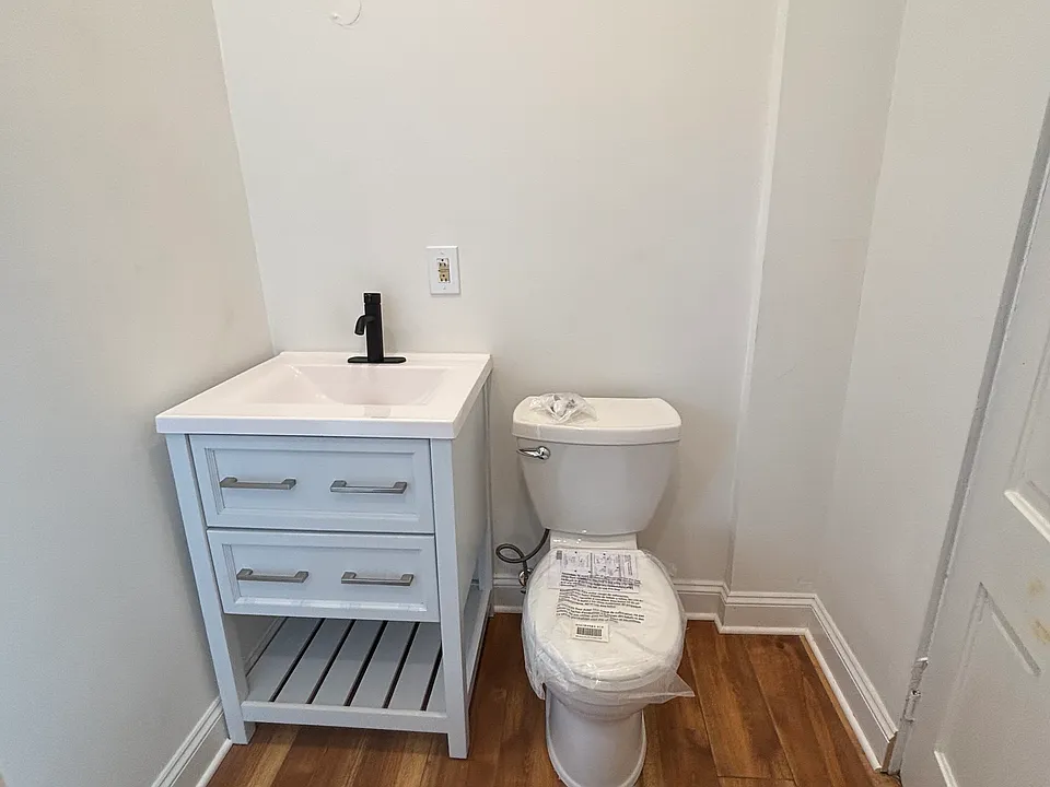 Bathroom sink and toilet. Mirror to come soon!