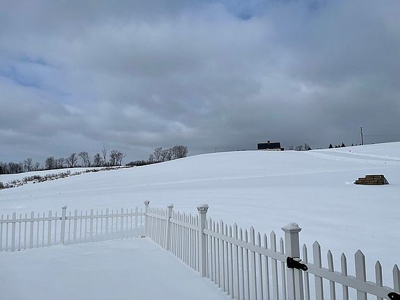 Hay fields beyond the lot