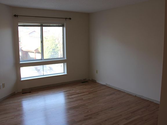 Downstairs living room. New hardwood floor. Entire unit with new paint.