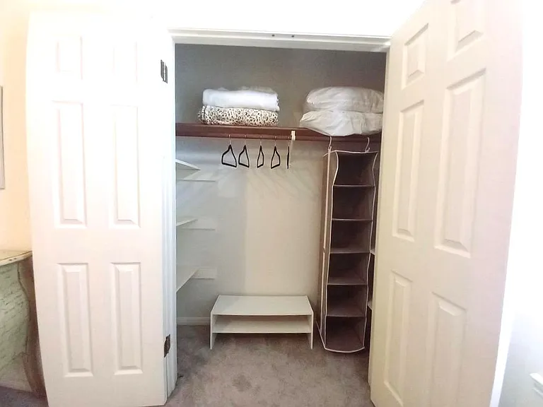 Hanging storage, extra blankets and pillows