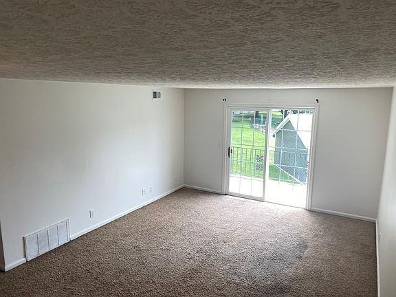Family room with sliding doors to balcony
