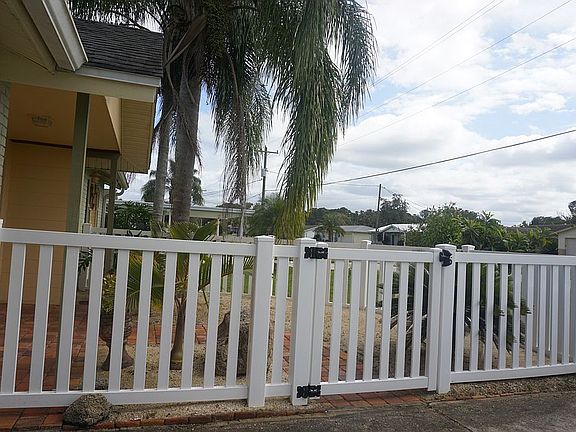 Newly fenced in paved patio 