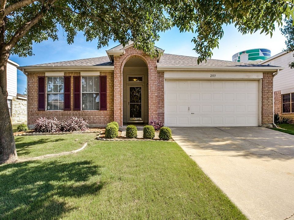 Welcome Home!! Great curb appeal with shutters and nice shade tree.