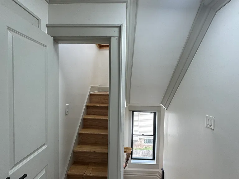 2nd floor landing w/ staircases to top & main floors!