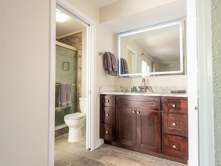 en-suite bedroom private bath with walk -in shower.