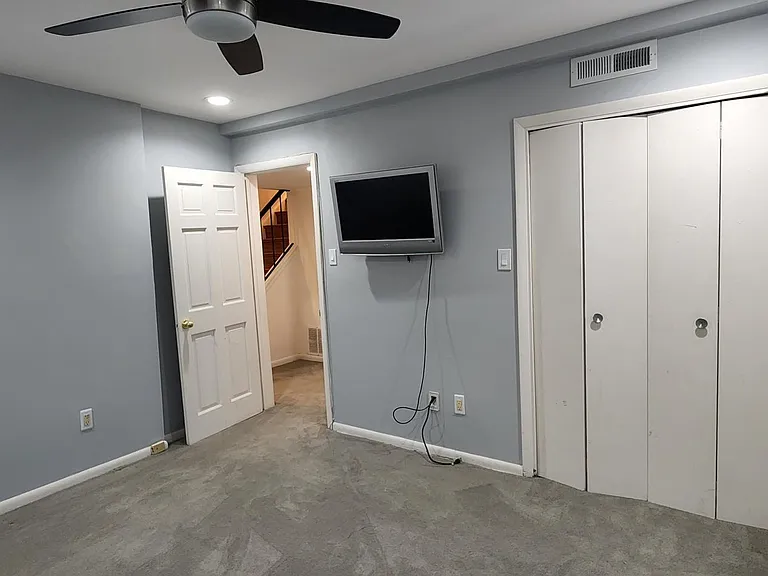 Fourth Bedroom - comes with TV and ample closet space. Full bath outside in the hallway.
