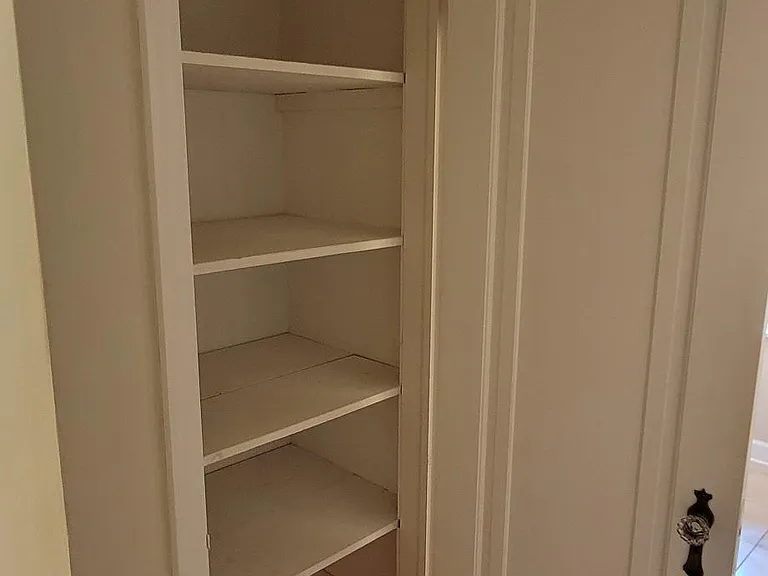 1 of 2 hall closets to main floor bathroom