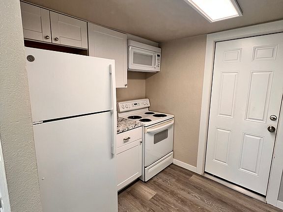 Door leads to 1 car garage