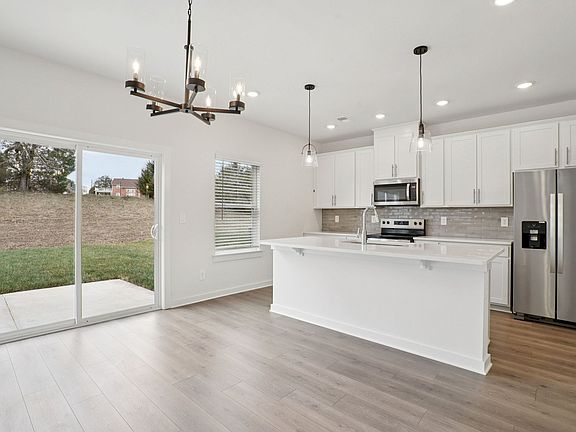 The open-concept floorplan allows for an easy flow between the kitchen and dining areas.