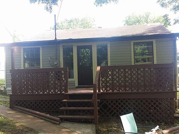Back of house: Large deck and patio: fully fenced in yard